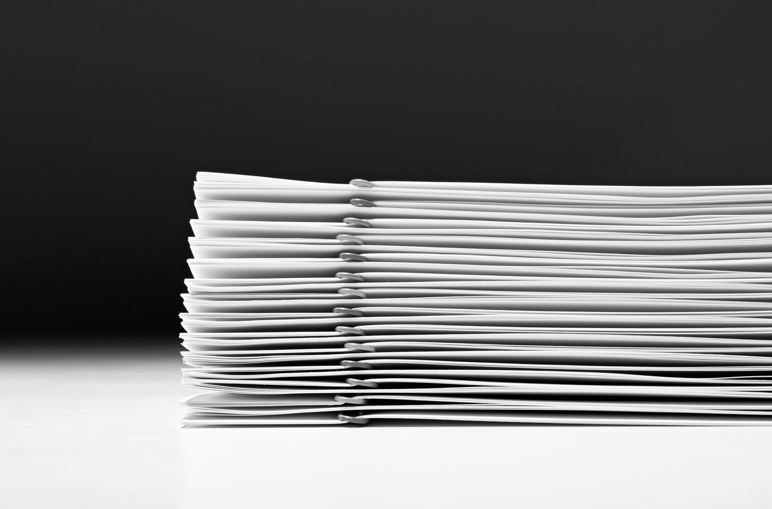 Stack of paperclipped papers close up